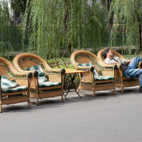 Picture of four wicker chairs in a street