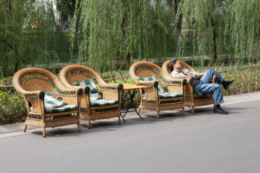 Picture of four wicker chairs in a street