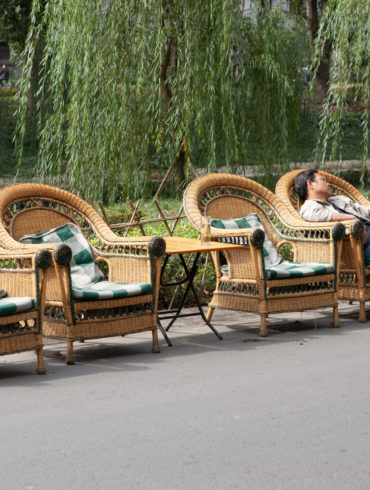 Picture of four wicker chairs in a street