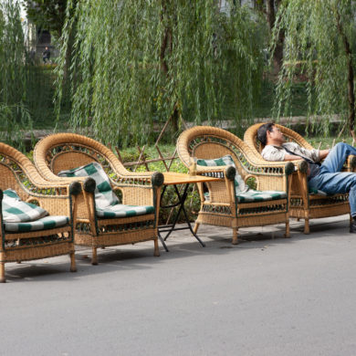 Picture of four wicker chairs in a street