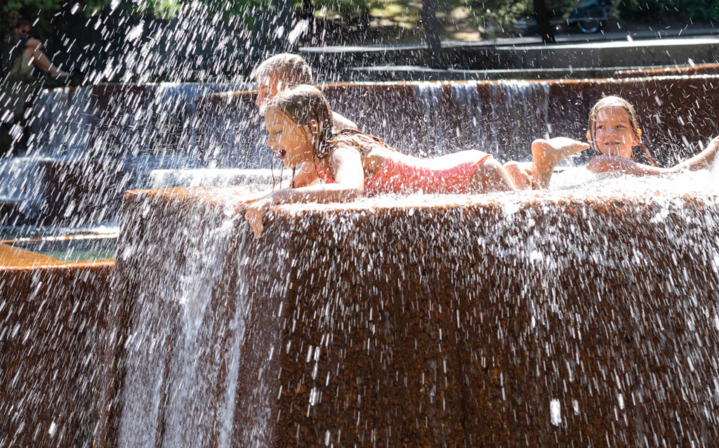 Girls among splashing water