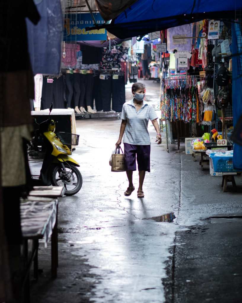 Woman walking along an alleyway