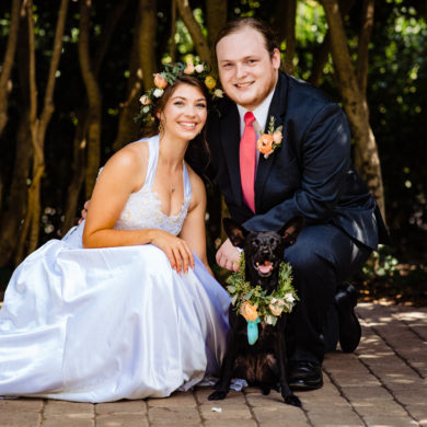 A bride, groom, and dog