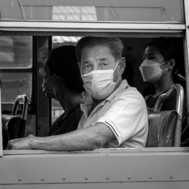 Man looking out bus window