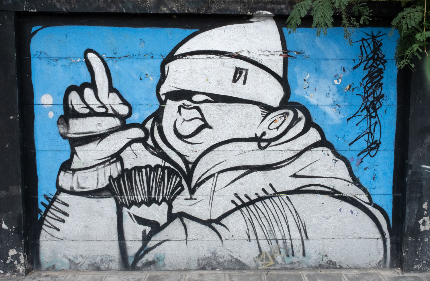 black, blue, and white graffiti image of a person smoking a cigar, wearing a hat and hoodie