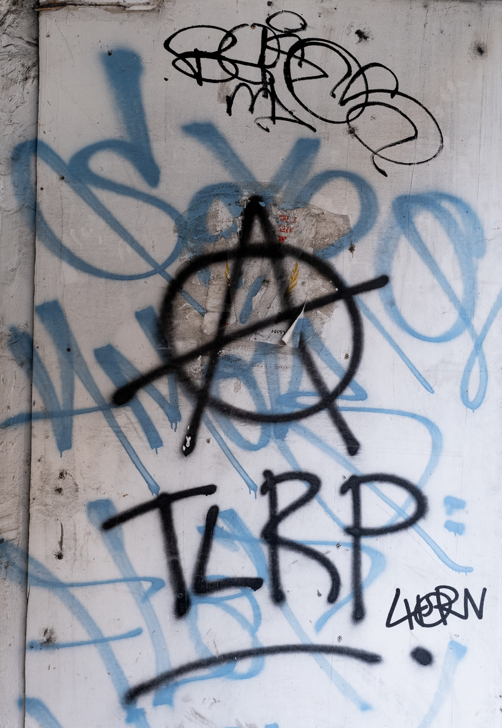 graffiti the antifa symbol with stylized letters behind