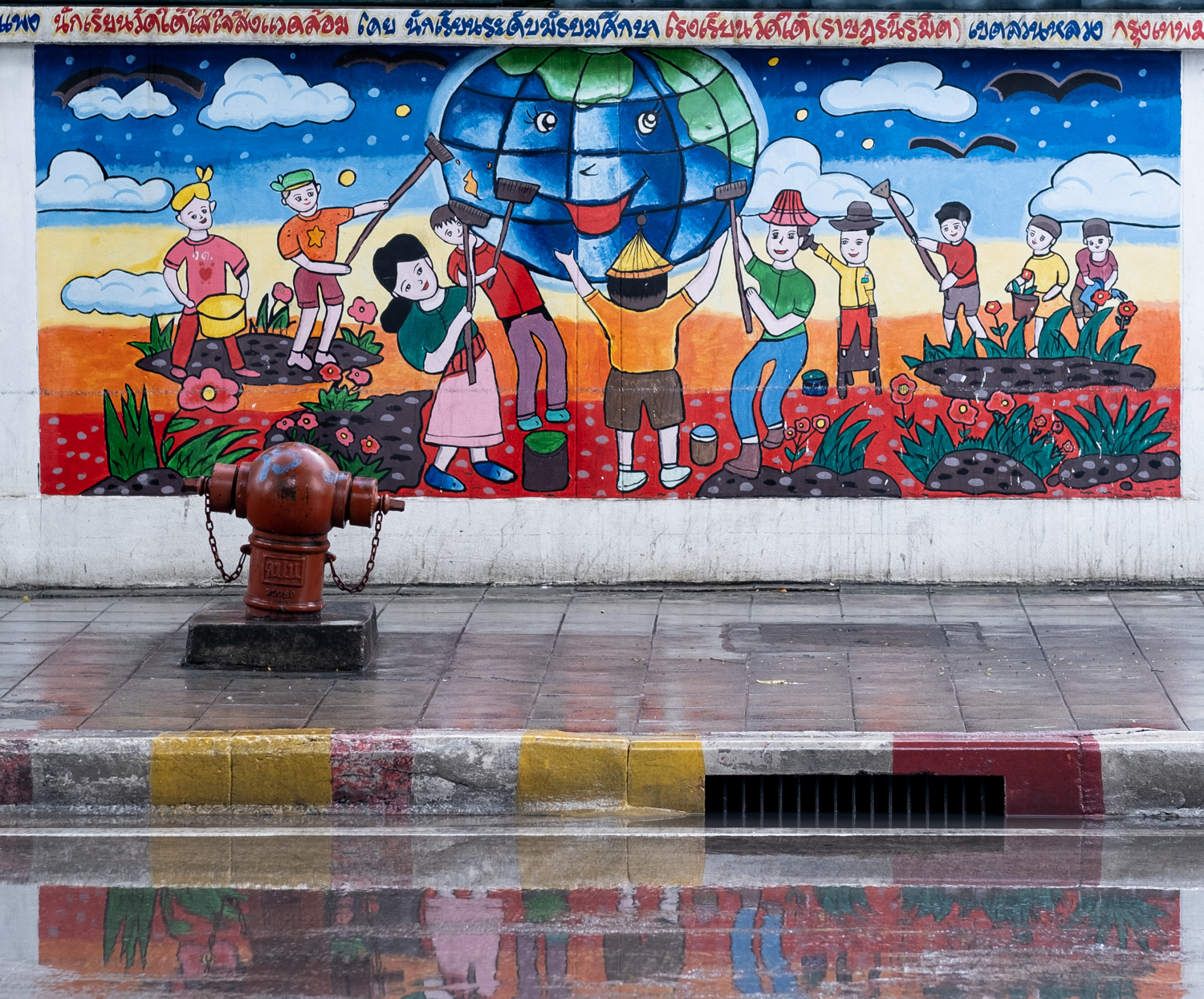 graffiti of people gardening with a happy earth globe in the sky