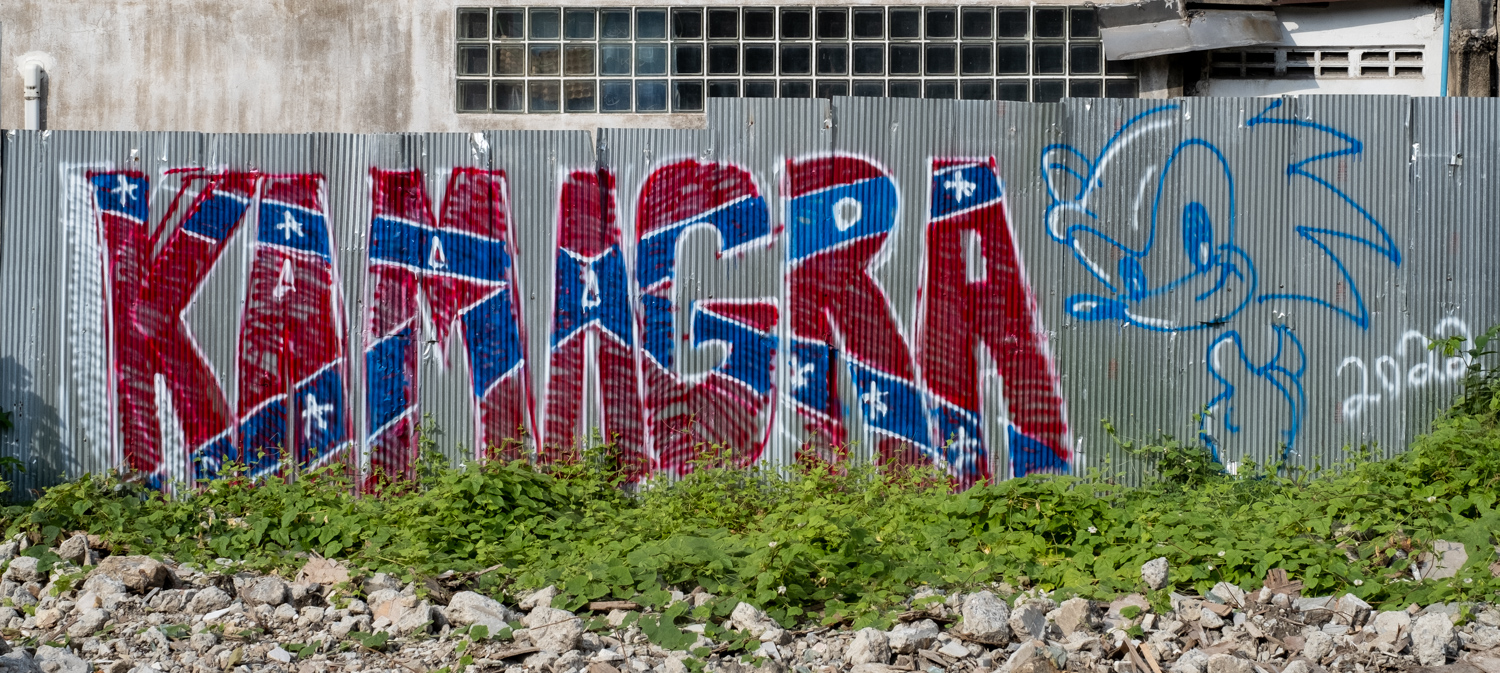 graffiti the word "Kamagra" designed like a U.S. Confederate flag