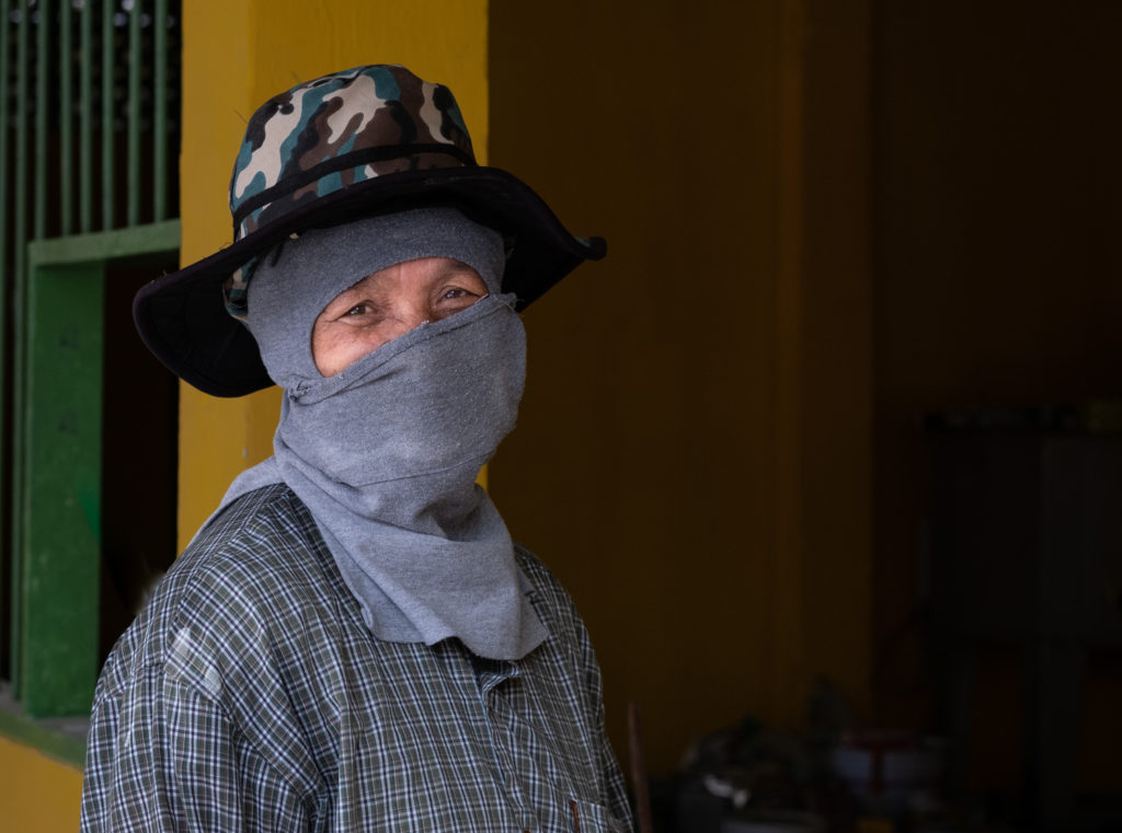 construction worker with entire face covered other than her eyes