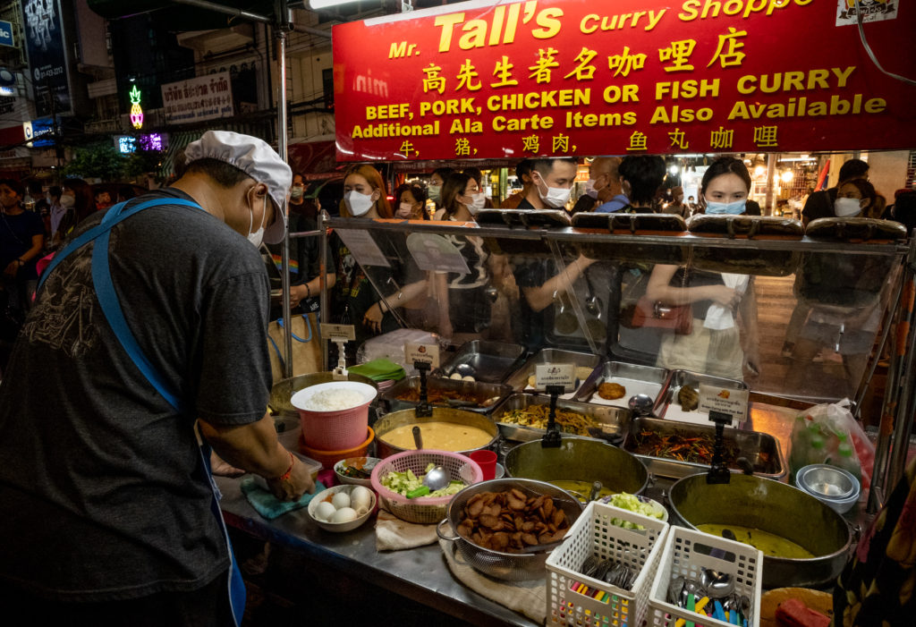 view from the back of a curry street stall