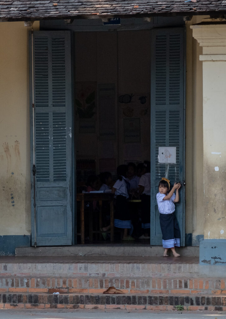 girl standing outside classroom