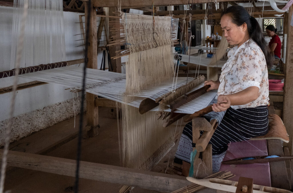 woman sitting at loom